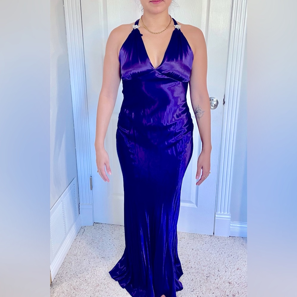 Long evening dress. Deep purple color.  Form fitting. Tags removed. Size 4.